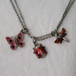 Avon pewter toned double chain necklace with butterfly, ladybut and dragonfly.